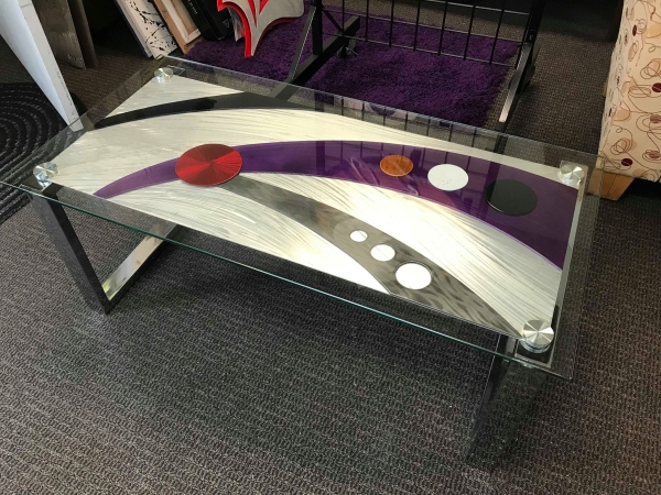 contemporary table and coffee table in aluminum.