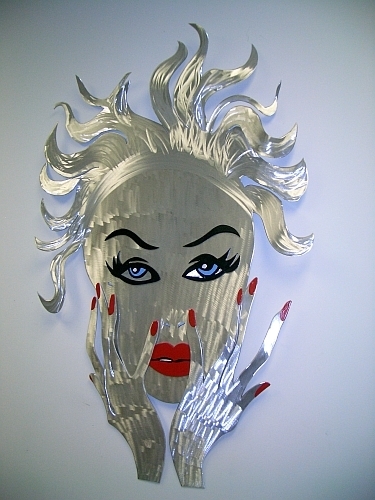 womans face sculpture in metal and brushed aluminum, art mask face is erotic and fantasy style art sculpture