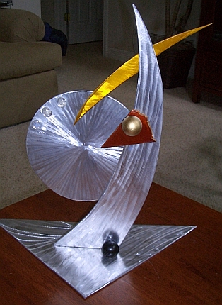 tabletop sculpture in aluminum and metal. mantle sculpture and small sculpture for a abstract sculpture