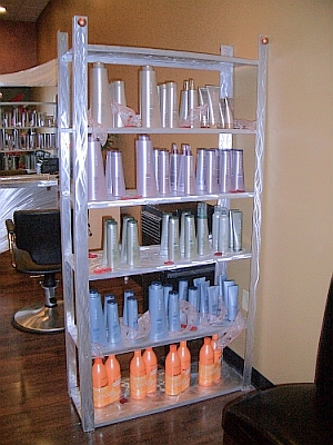 custom shelf in brushed aluminum for a salon and spa