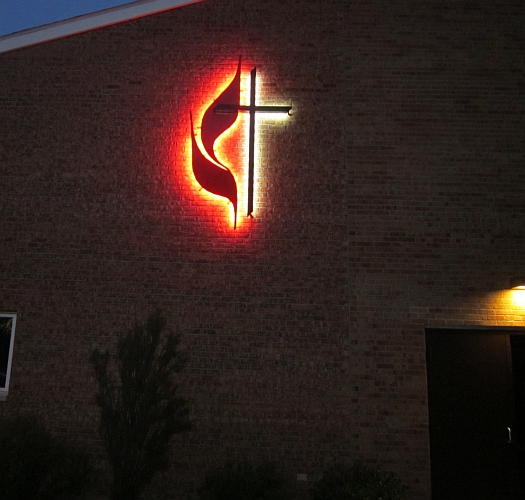 united mthodist cross and flame logo sign. United methodist croos and flame backlit in red and white LED