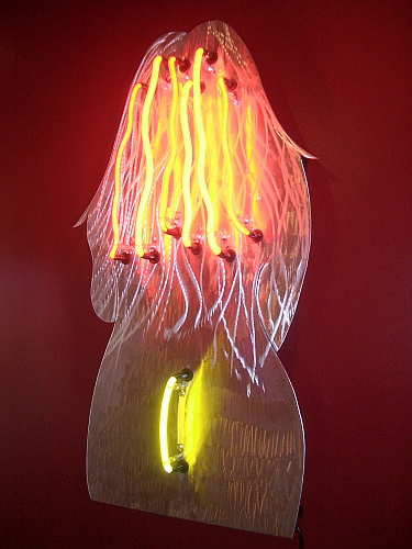 neon art figure of a women in orange neon and red neon. this neon sculpture is a must for neon lovers